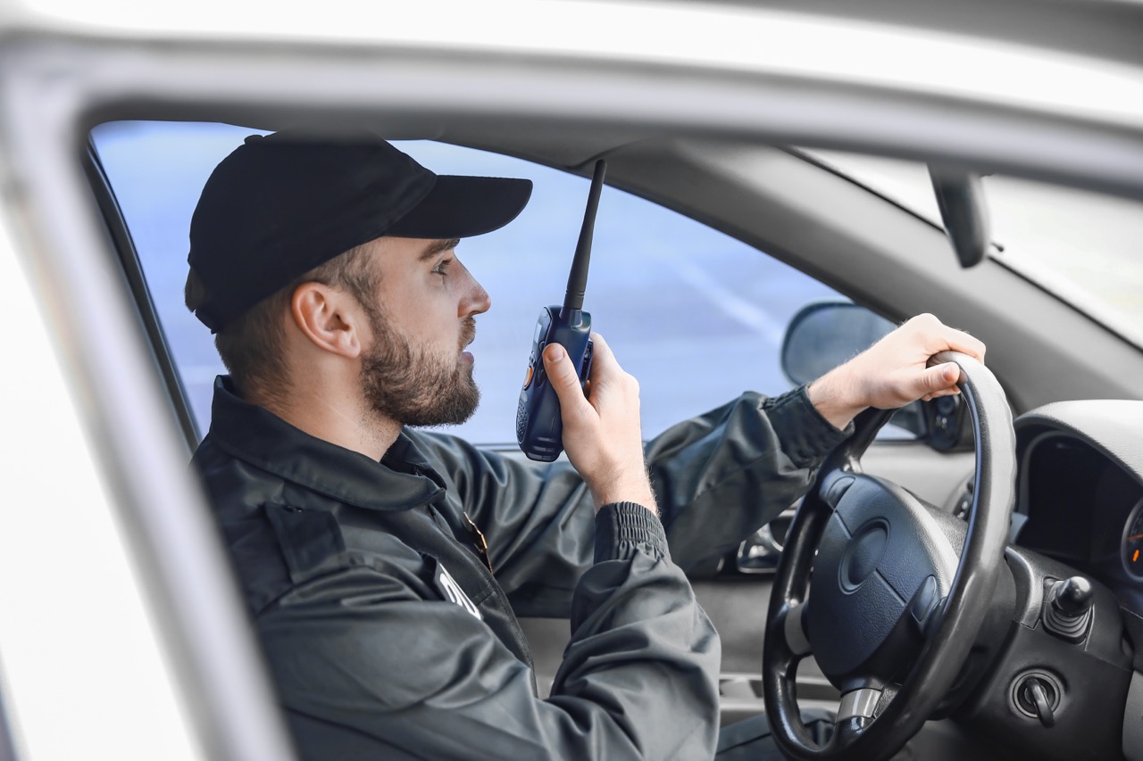 Security officer coordinating a vehicle patrol